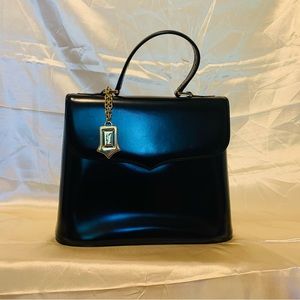 Vintage YSL top handle bag in patent leather.